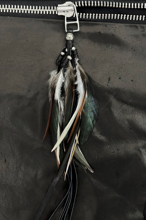 Feathers on zipper