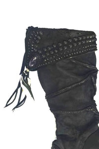 Additional small stone with leather fringe and feathers